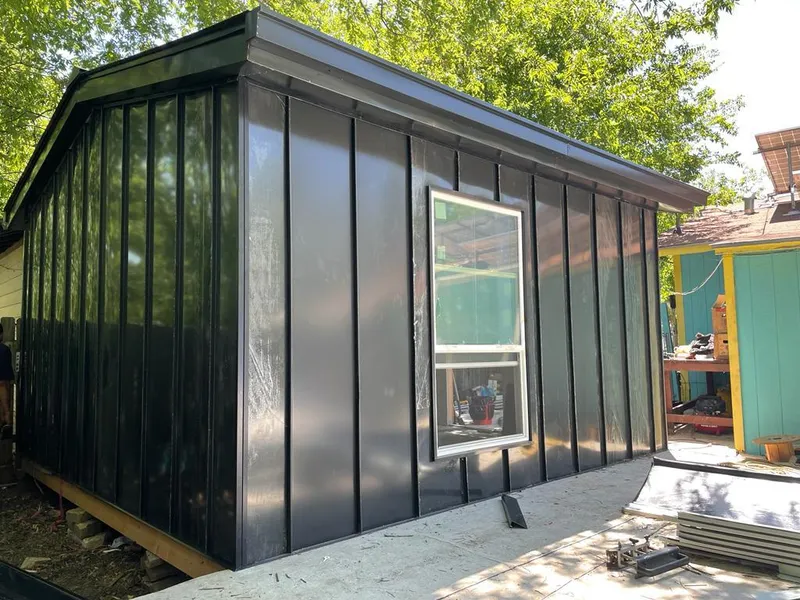 Black standing seam metal wall panels for Roof Inspection in Saline