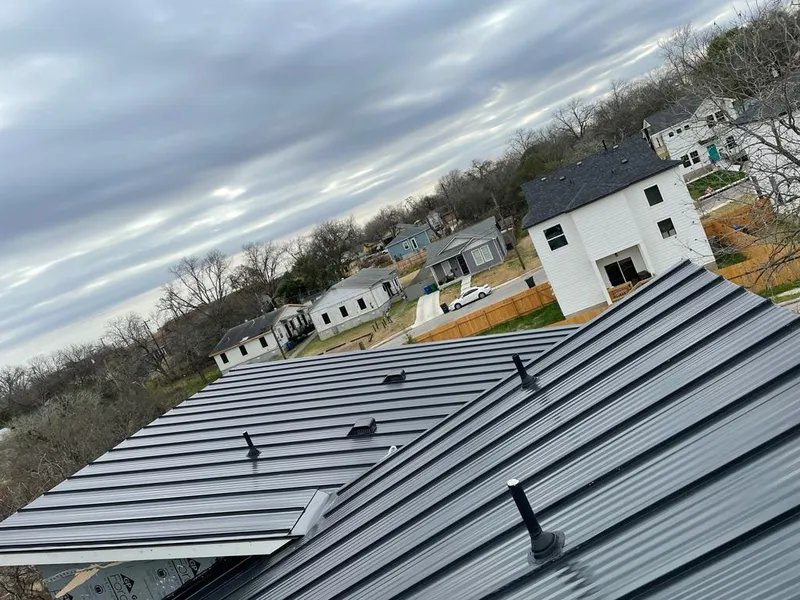 Standing seam metal roof panels with vents for Skylight Repair in Saline